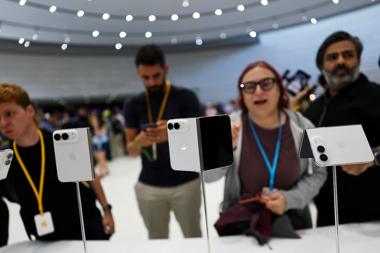 People look at a display of phones
