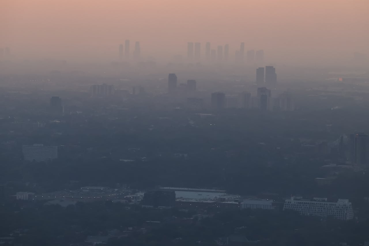 A distant view of Toronto through smoke