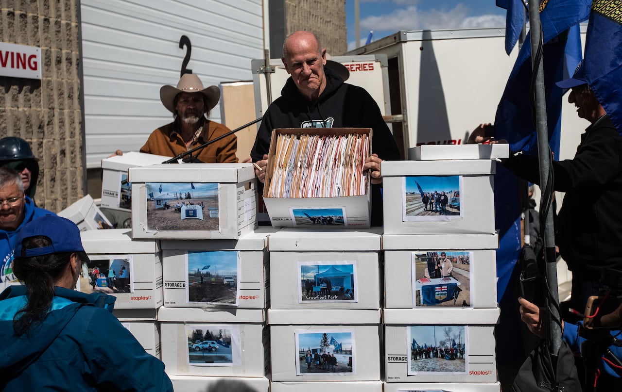 A man loads a series of boxes.