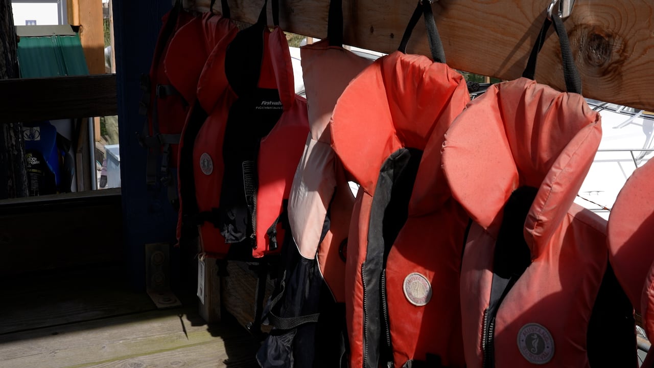 A bunch of red lifejackets