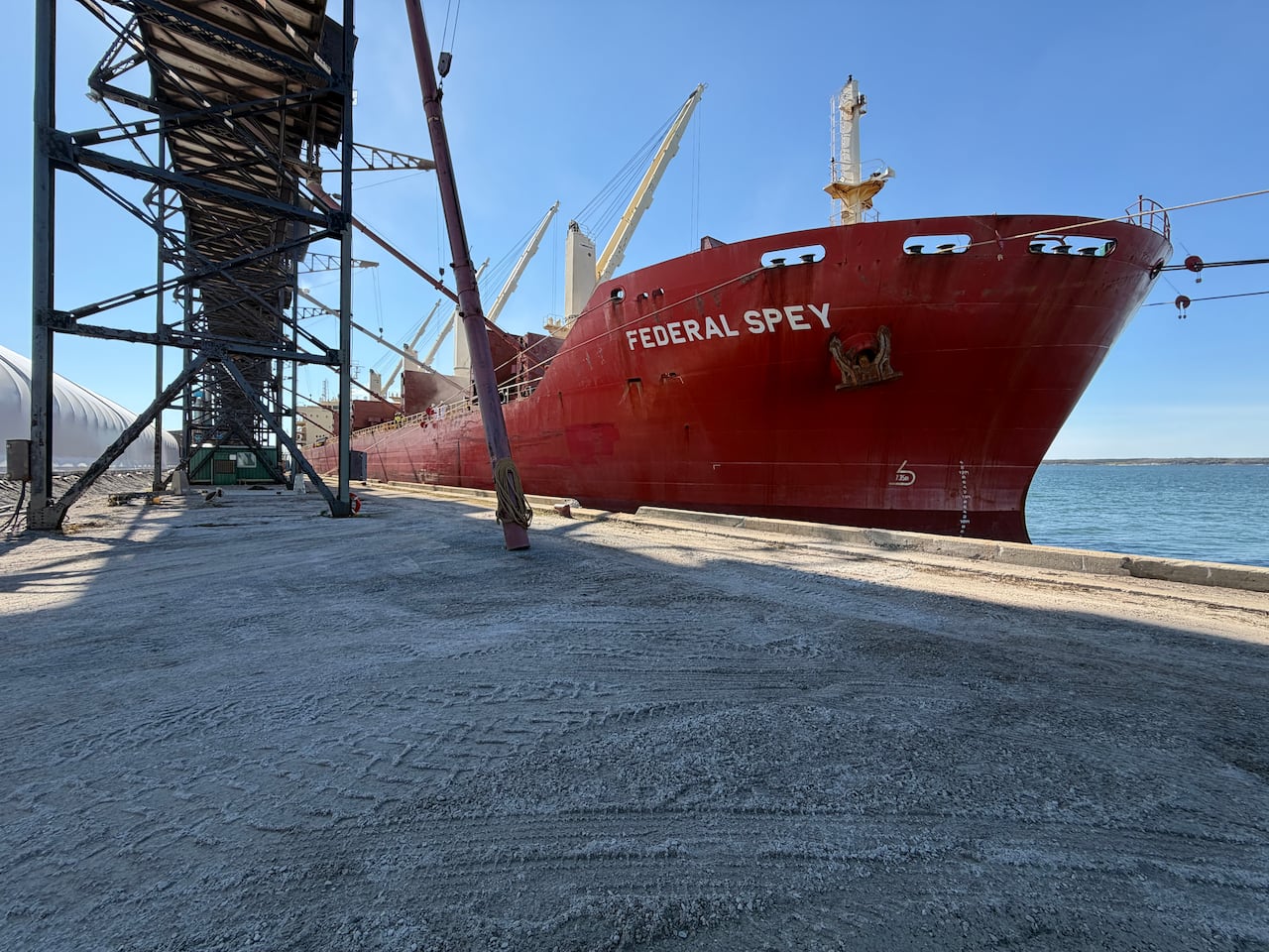 A large ship by a dock