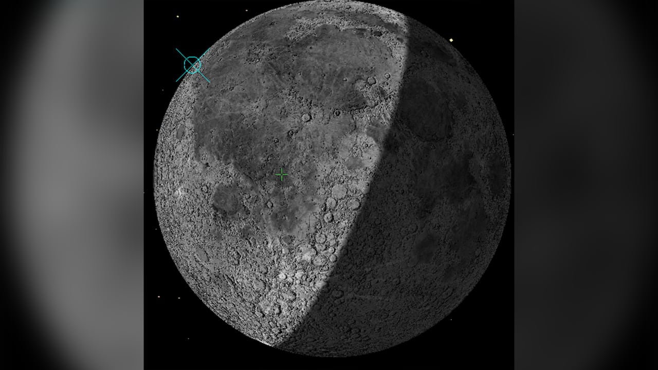 An image of the moon with blue crosshairs.