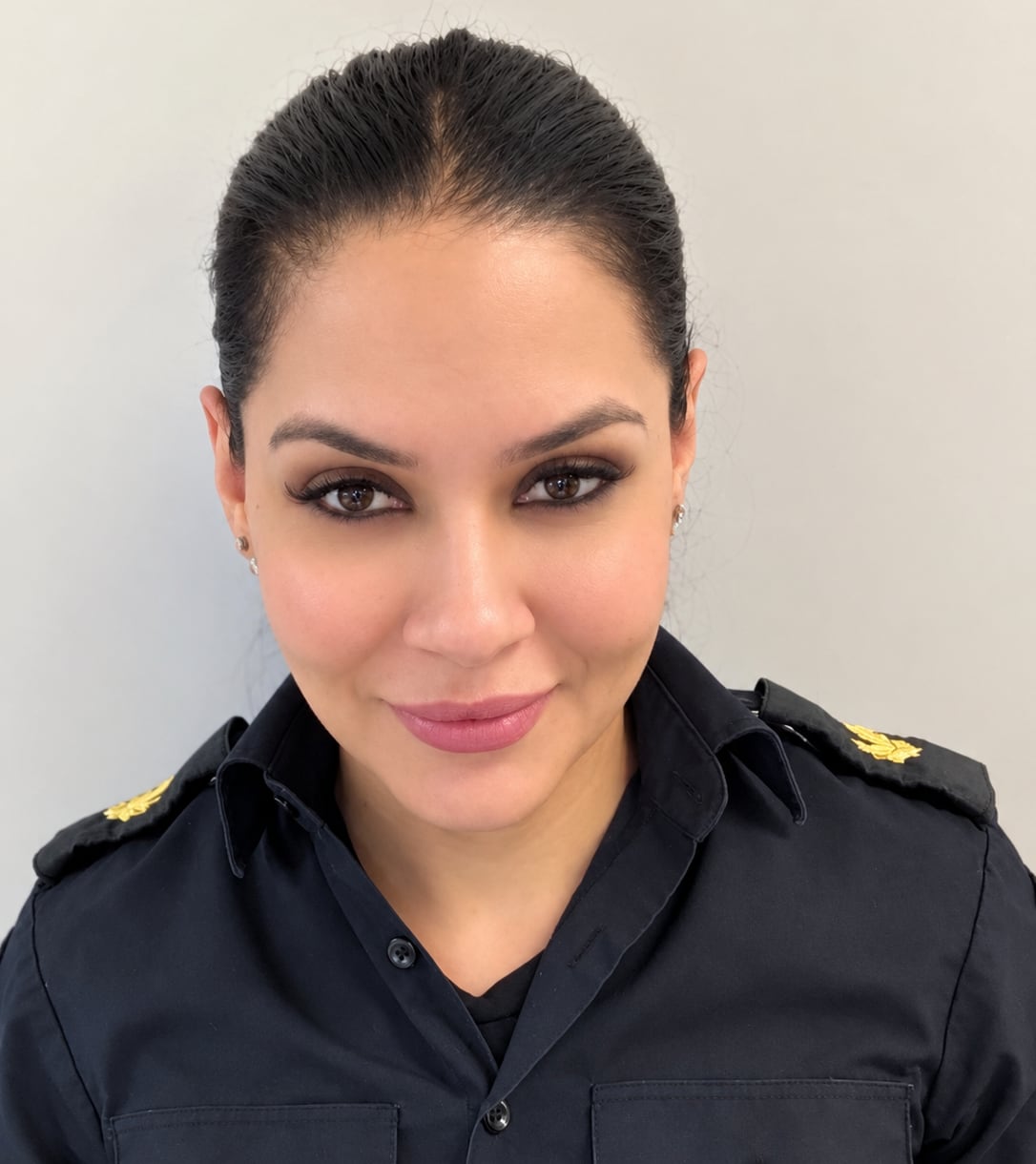 Woman in a corrections officer uniform.