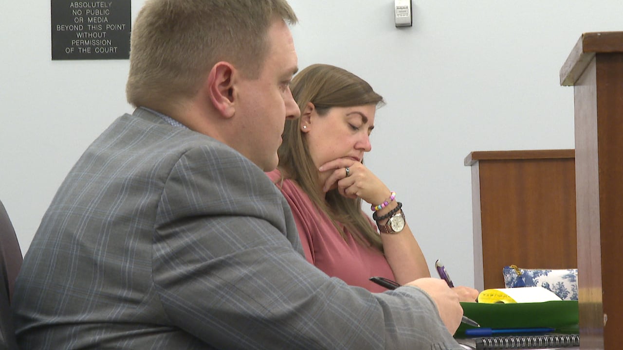 Two lawyers in a courtroom.