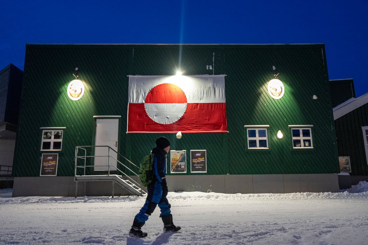 A young boy walks in Nuuk, Greenland