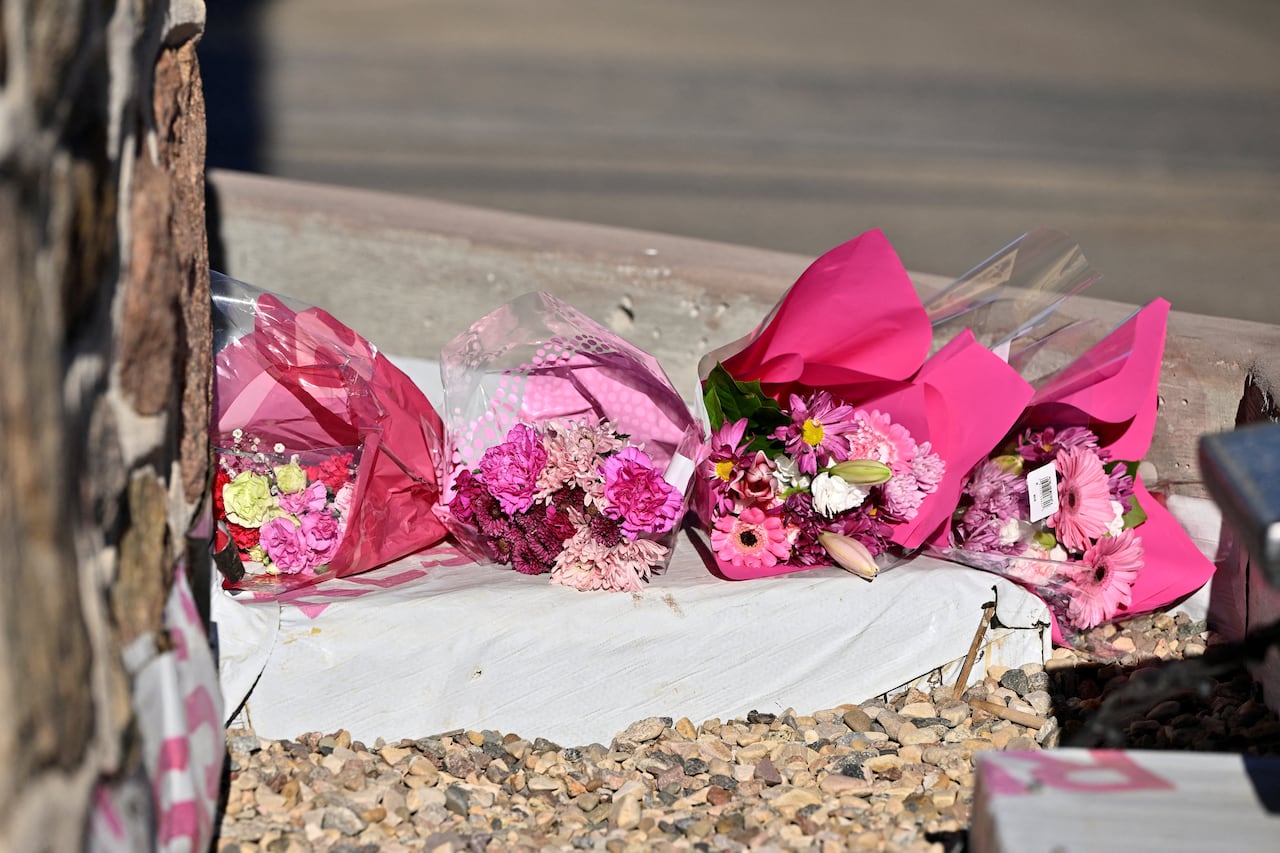 Pink flower bouquets laid on the ground