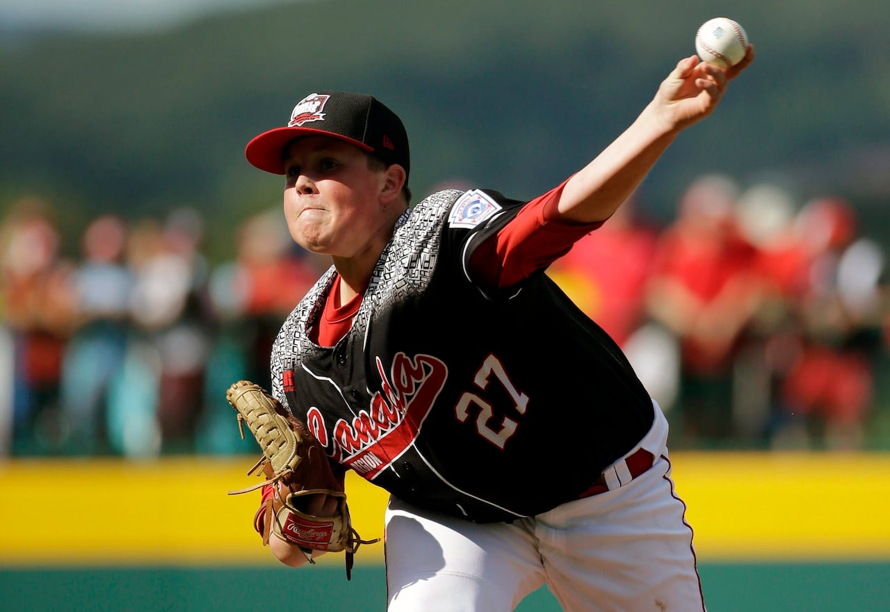 Canada's Matthew Wilkinson pitches during the first inning of an International pool play baseball game against Mexico at the Little League World Series, Friday, Aug. 21, 2015, in South Williamsport, Pa. Mexico won 1-0. (AP Photo/Matt Slocum)