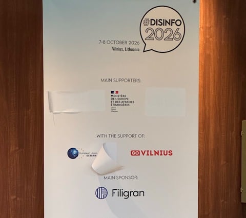 The government of Canada logo was covered up on signs spotted around the anti-disinformation conference.