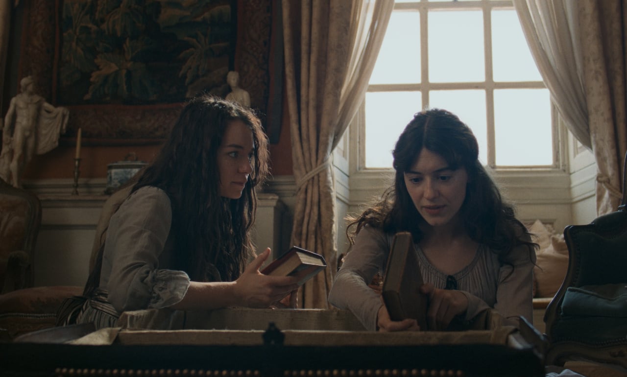 Two women speaking.