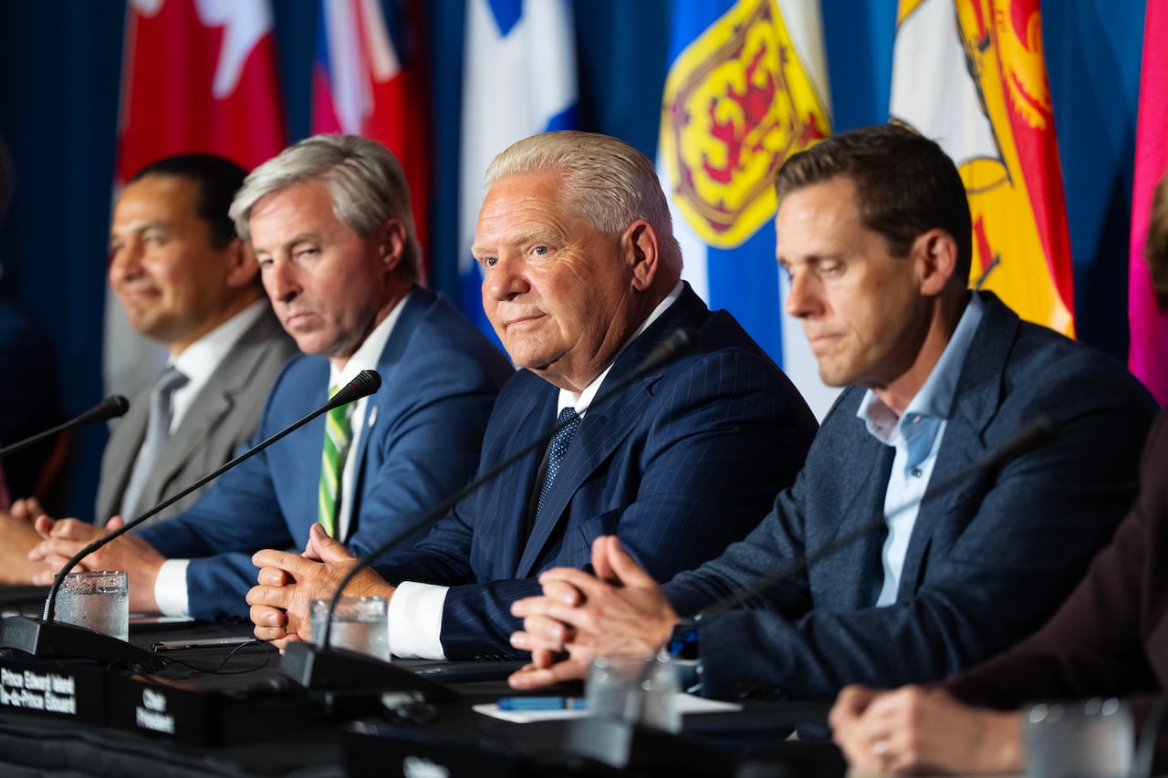 Ontario Premier Doug Ford, second from right, listens to a question with fellow premiers