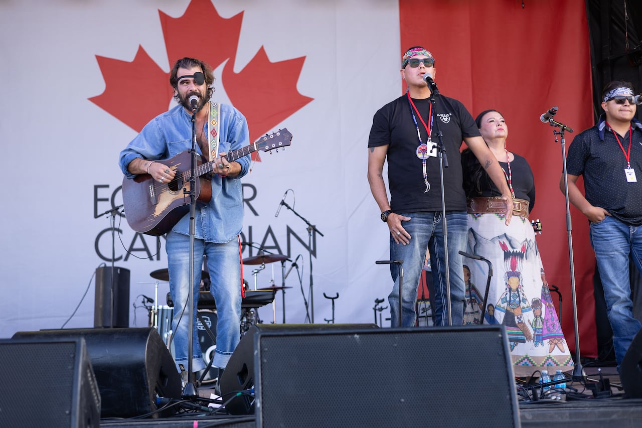 A group performs on a stage.