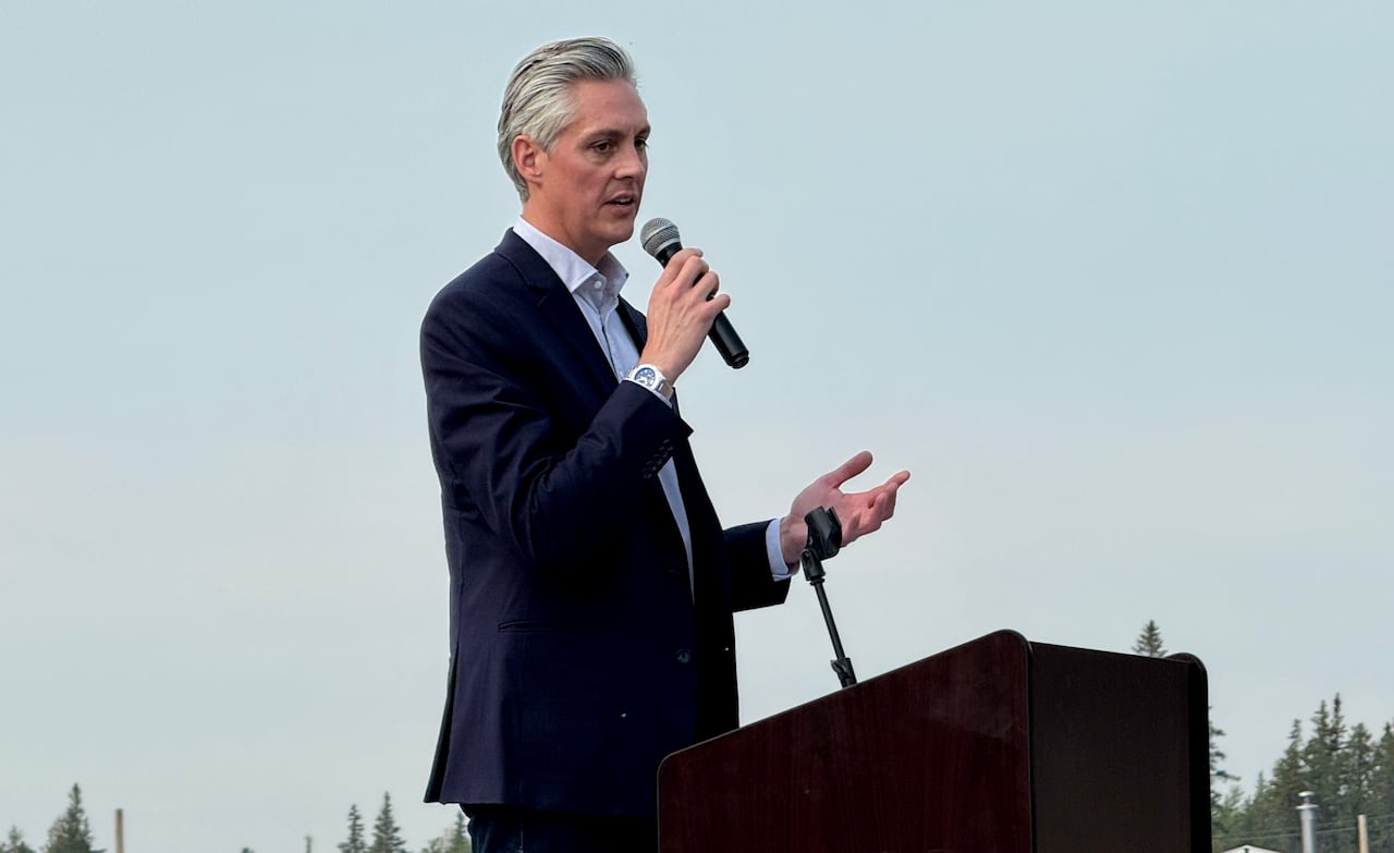 A man talks at a podium