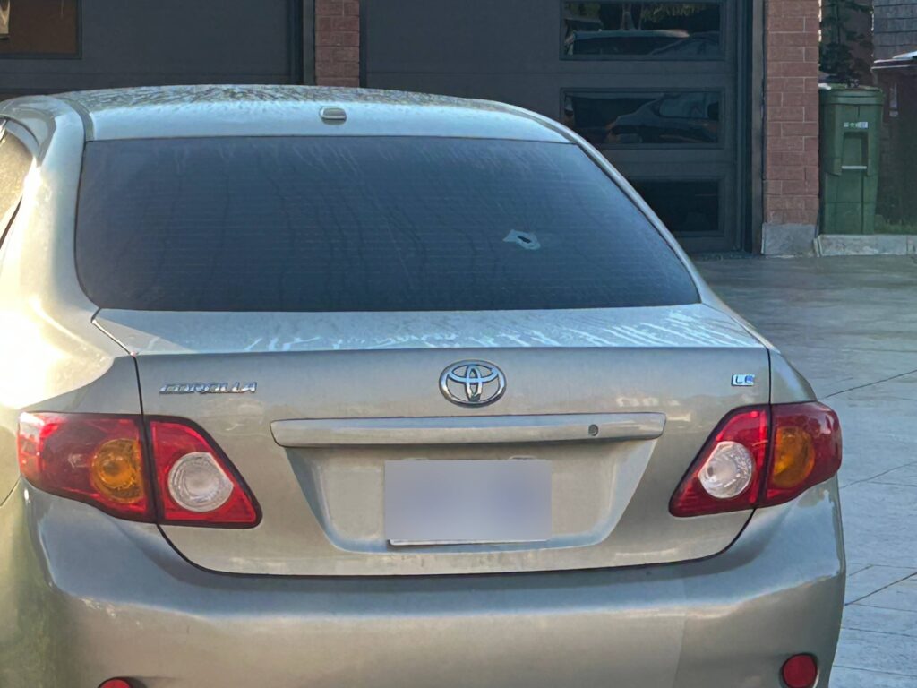 Toronto police say gunfire struck a parked vehicle outside a home near Finch Avenue West and Humberline Drive in Rexdale on Aug. 18, 2026