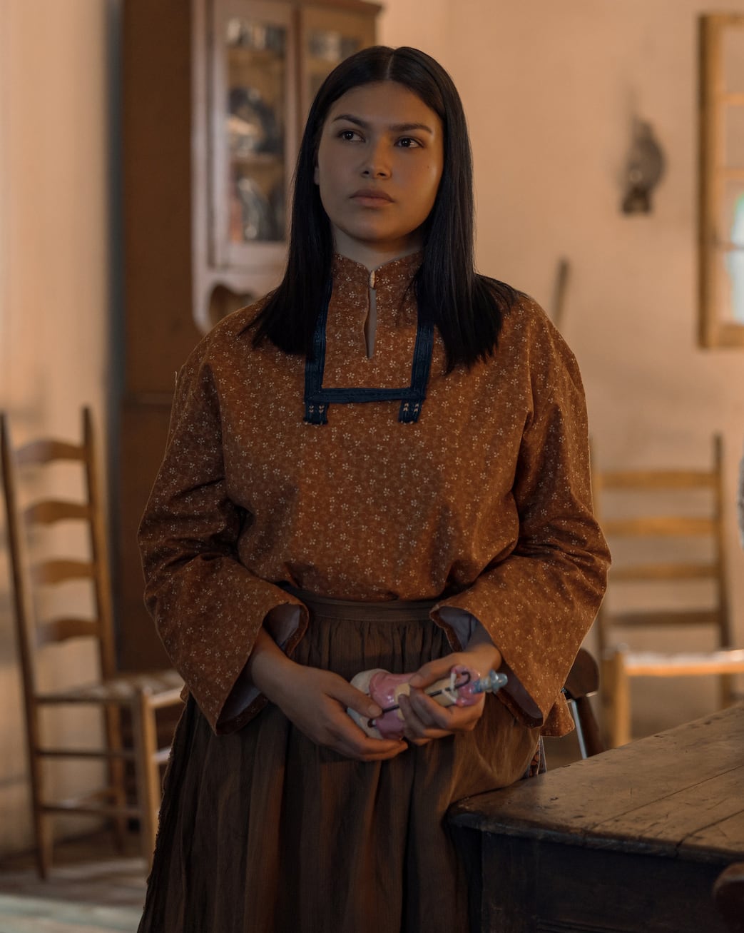 Indigenous woman dressed in traditional Osage clothing.