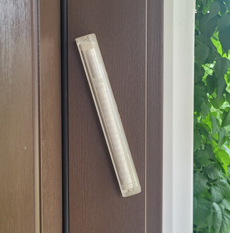 Mezuzahs hung on a door