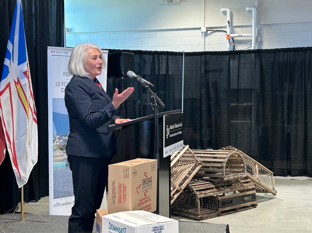 A woman speaking at a podium