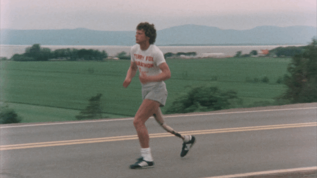 Terry Fox is seen running on the highway during his Marathon of Hope.