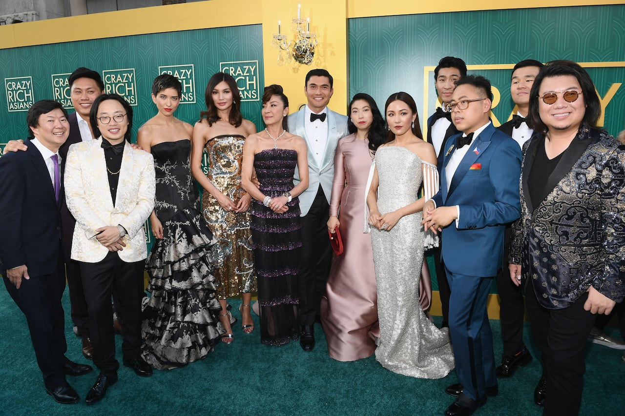 Dressed-up cast poses.