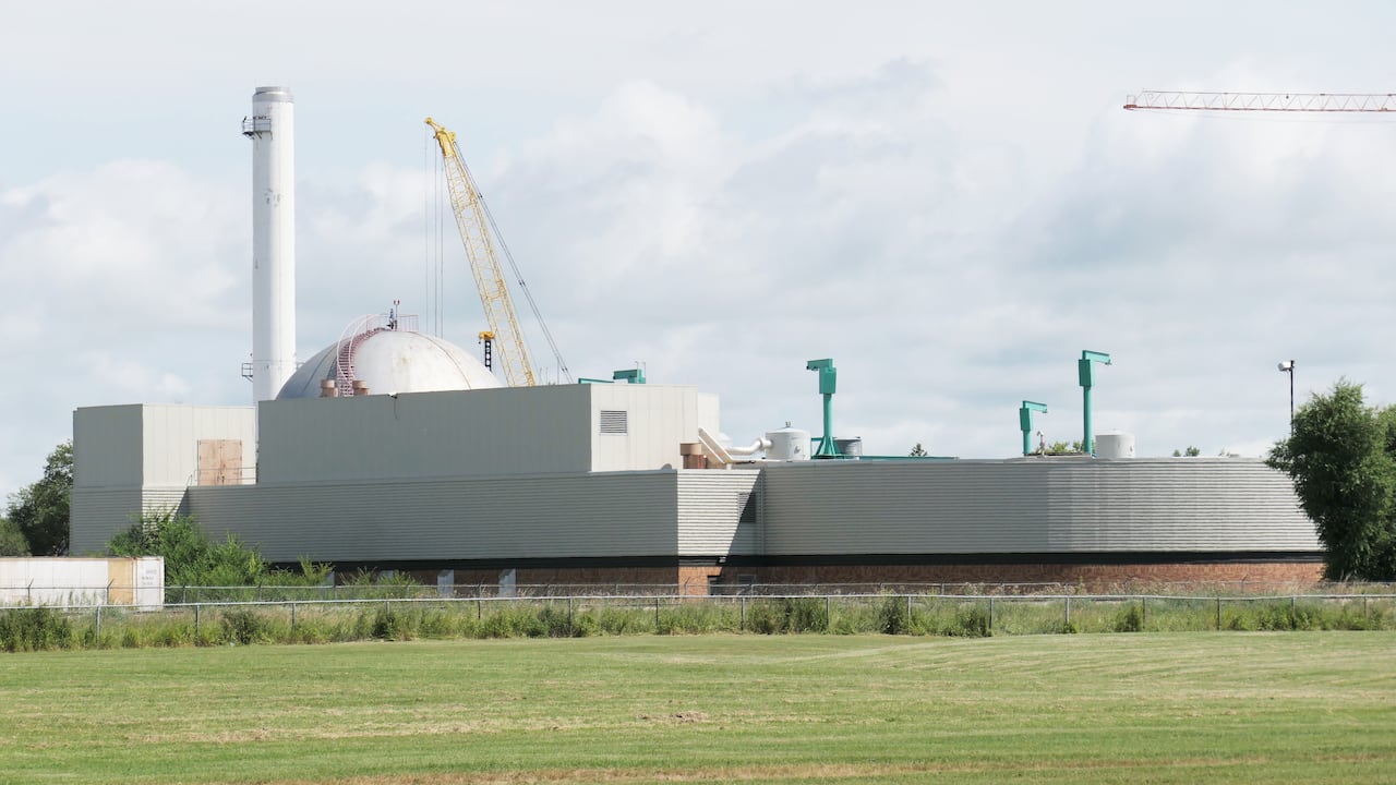 An industrial building with a crane.