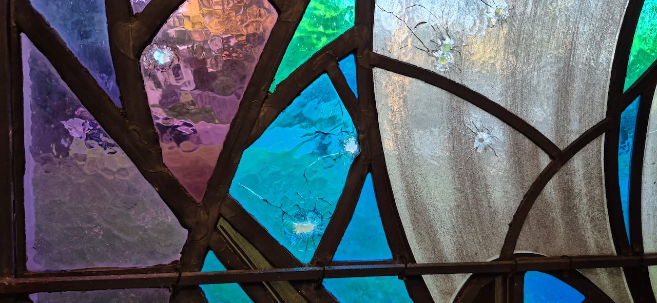 apparent bullet holes in window of Sons of Jacob Synagogue pictured on Tuesday, Sept. 22, 2026