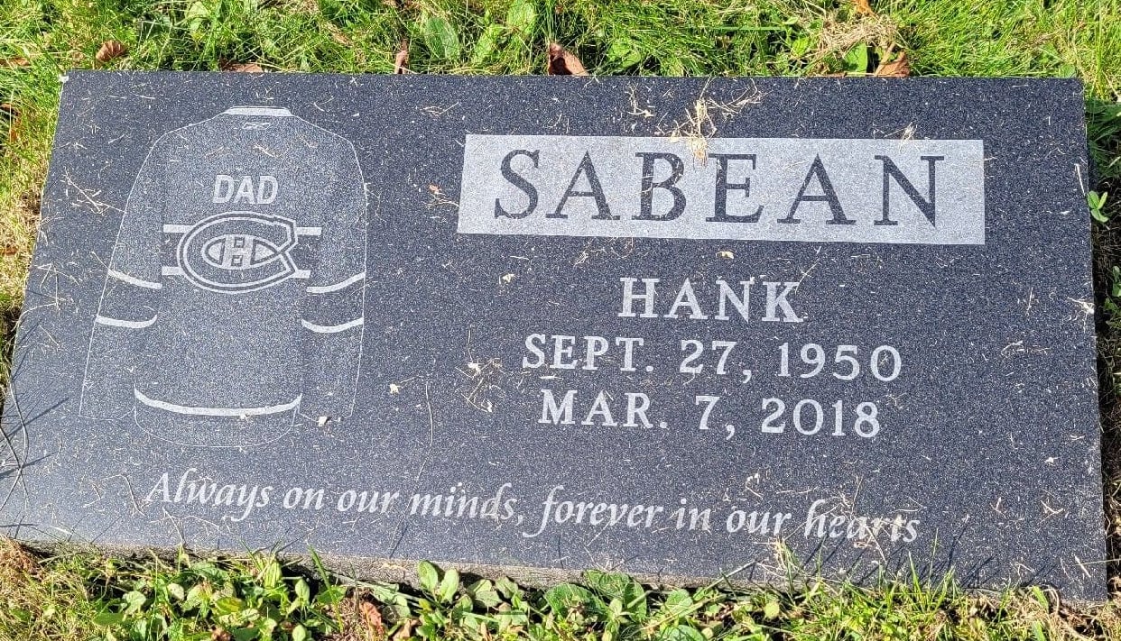 A grave is pictured with the words Sabean, Hank. Sept. 27, 1950 to Mar. 7, 2018.