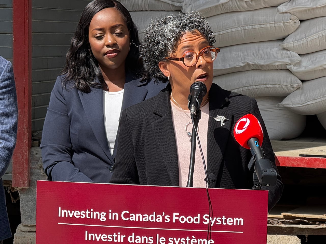 A woman speaking at a podium