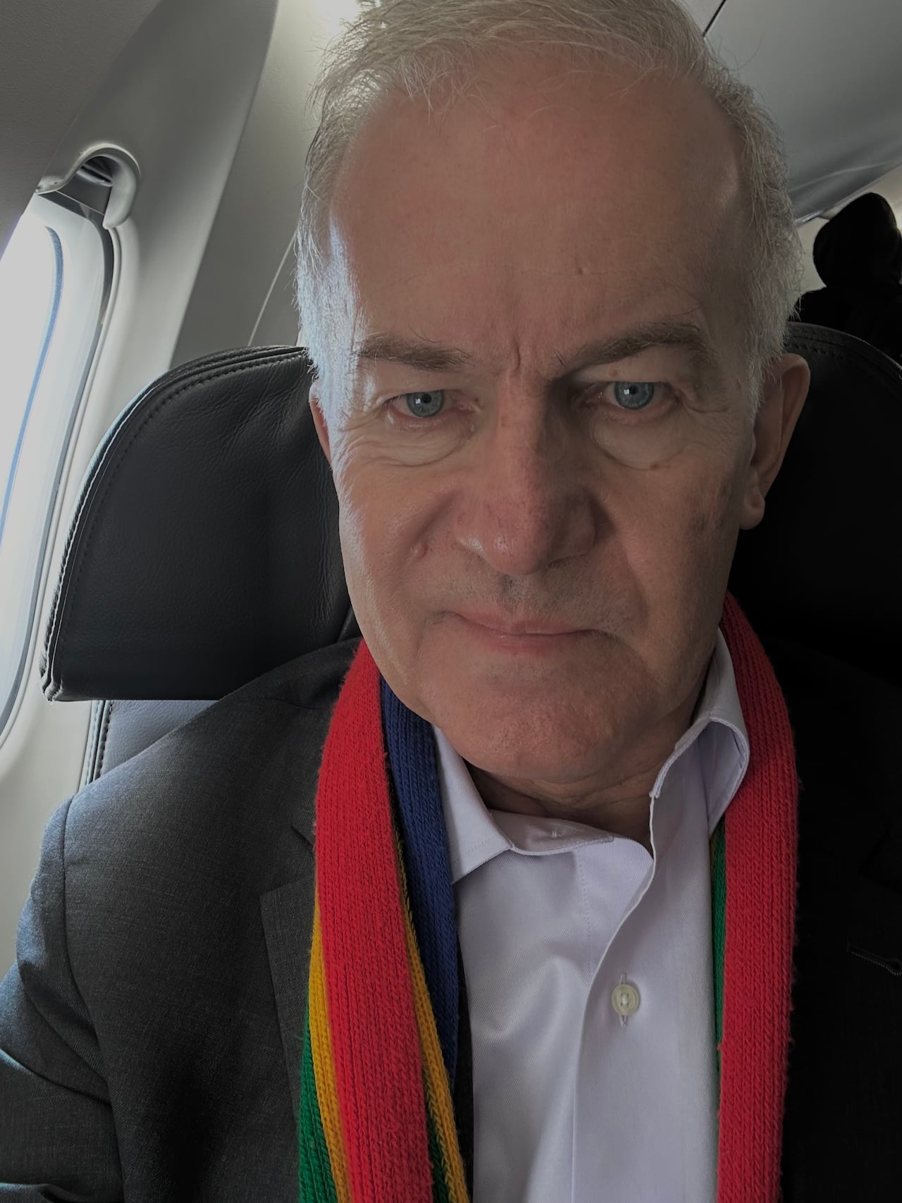 Selfie of man seated on plane