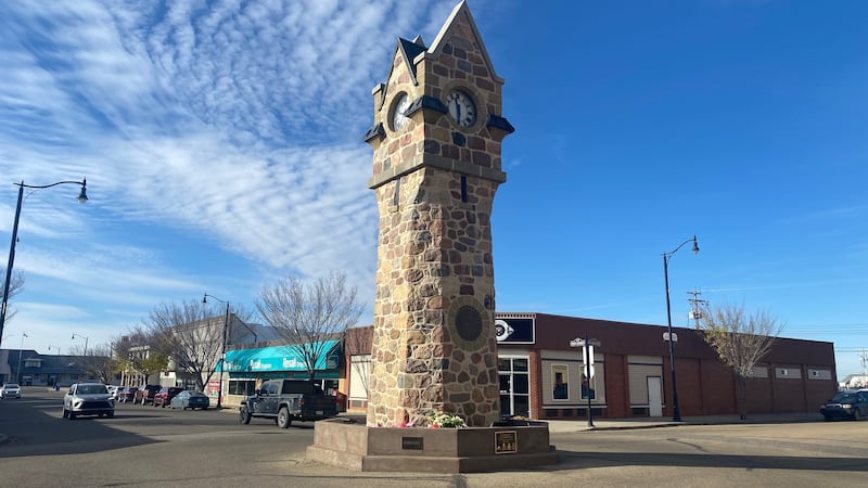 Flowers are seen at the Memorial Clock Tower on Main Street in Wainwright, Alta., on Oct. 19, 2026, two days after the deadly incident at the local Canadian Armed Forces base. (Darcy Seaton / CTV News Edmonton)