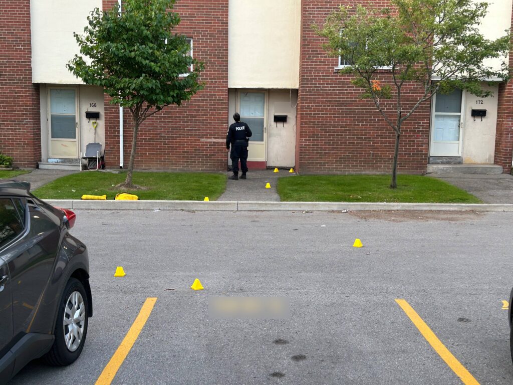 Toronto police evidence markers are seen at a townhouse complex on Danzig Street in Scarborough on Aug. 11, 2026