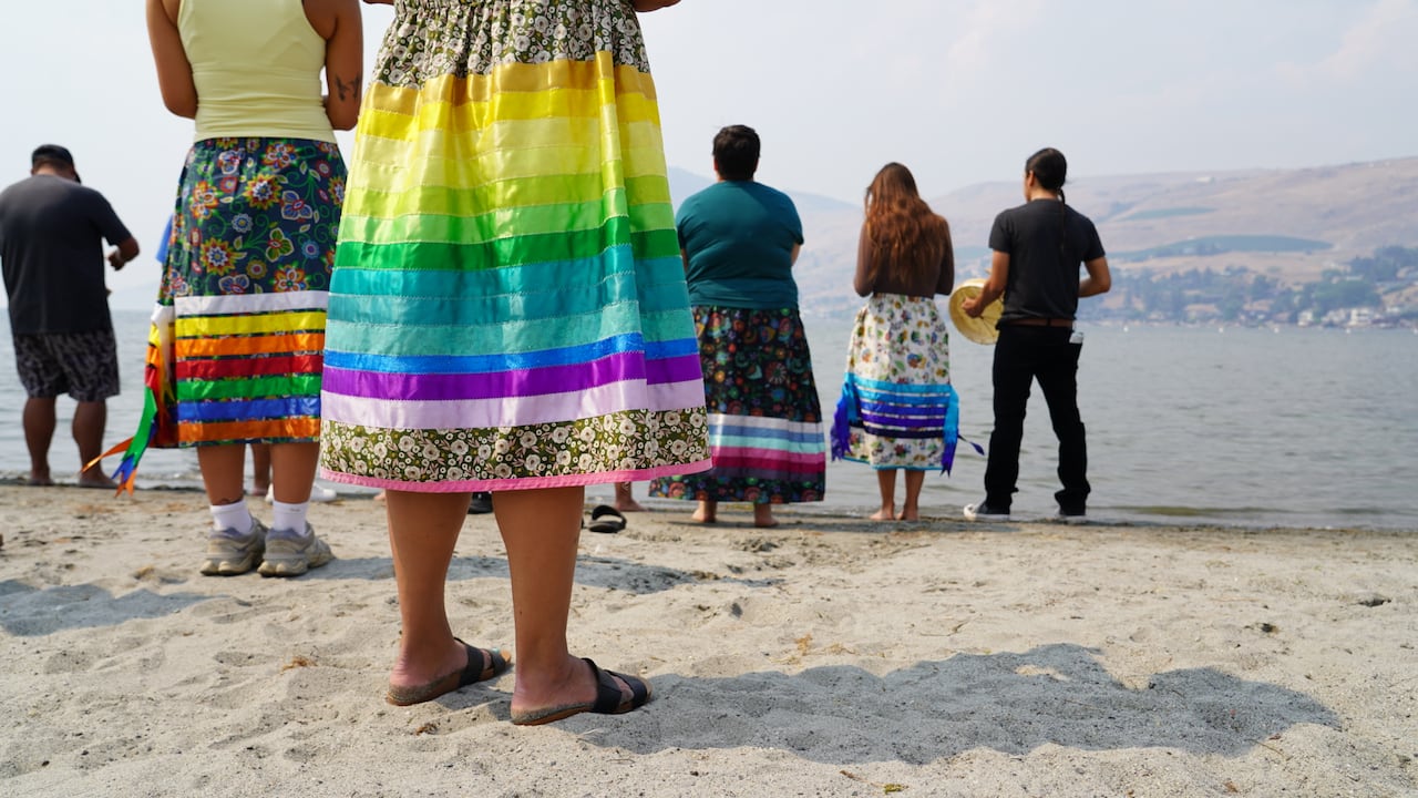 gathering of women in ribbon skirts