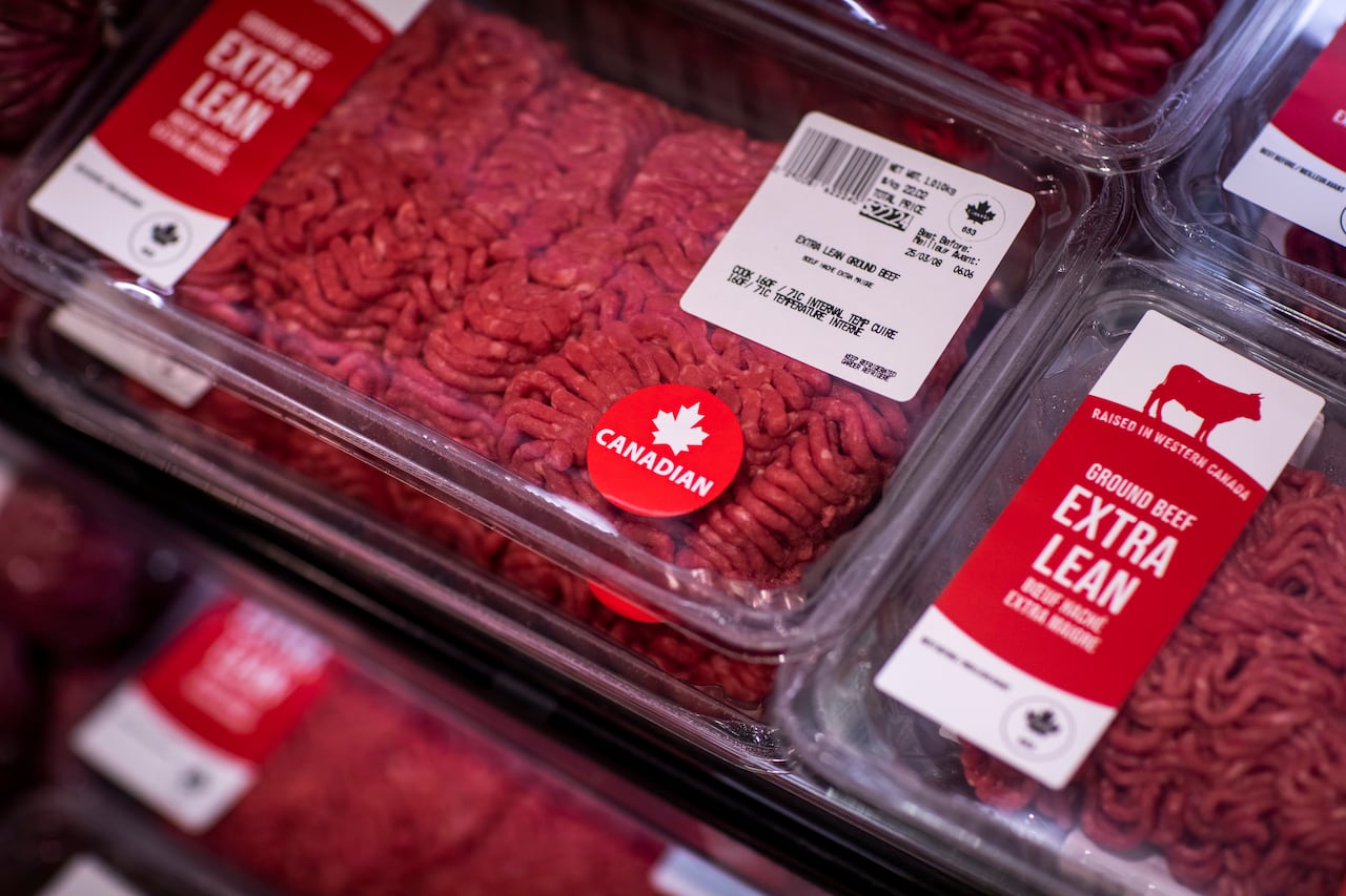 Packaged ground beef with "raised in Western Canada" labels.
