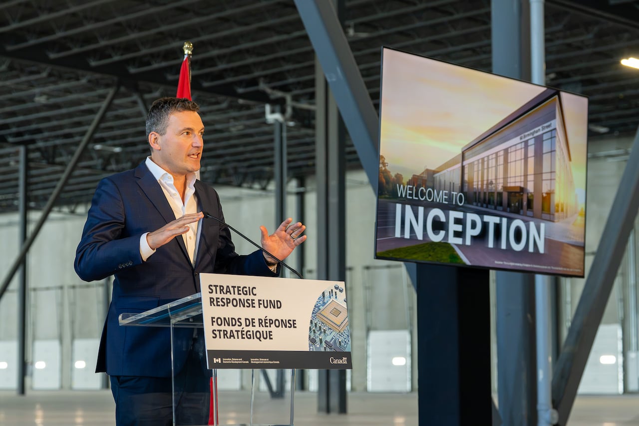 A person stands at a podium.