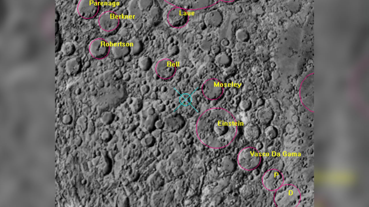 A close-up image of an area of the moon with the names of several craters and a blue crosshair.