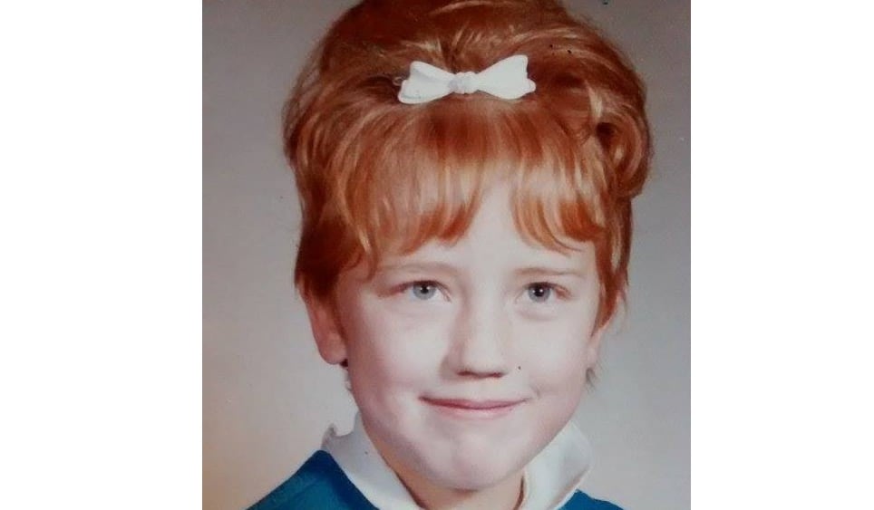 A red-headed girl.