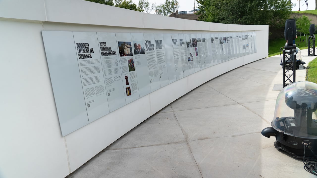 a large grey wall with text