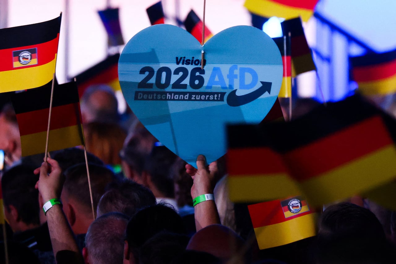 Supporters of the far-right Alternative for Germany (AfD) party display flags at the party's campaign kick-off event ahead of the Saxony-Anhalt state election, in Magdeburg, Germany, July 18, 2026.