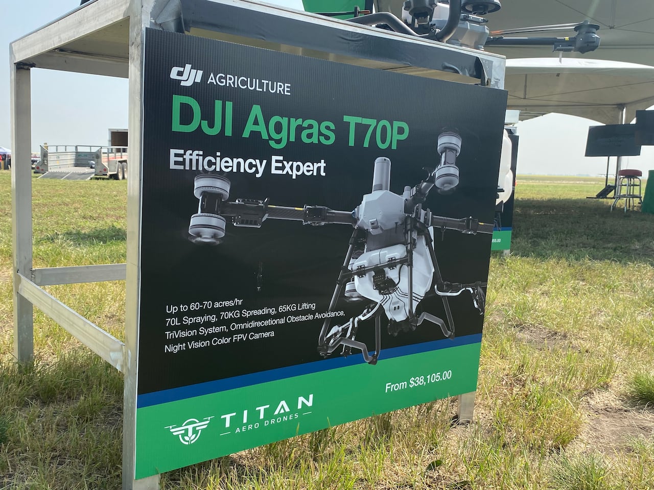 A poster attached to a table shows a picture of a drone and a price tag of more than $38,000.