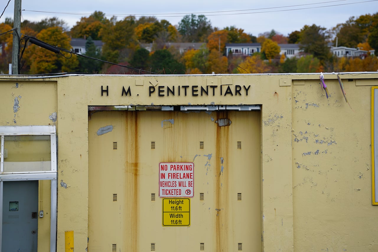 A sign that says H.M. Penitentiary.