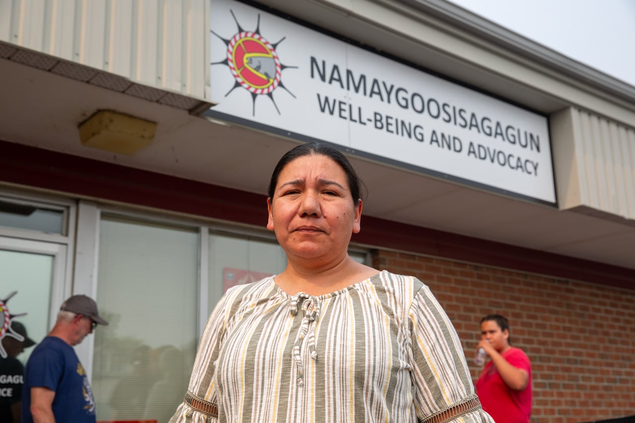 A person is seen standing outside an office.
