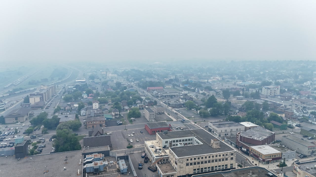 An aerial shot of a hazy city.