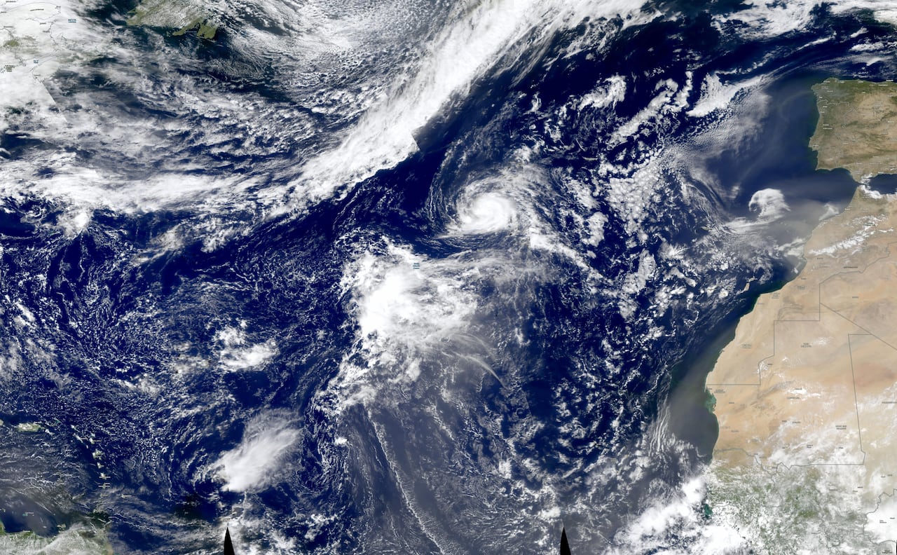 A satellite view of the Atlantic Ocean with cloud cover.