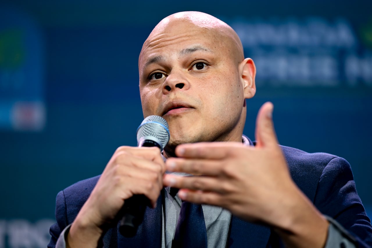 Conservative MP Jamil Jivani holds a microphone while speaking at a May 2026 event in Ottawa.