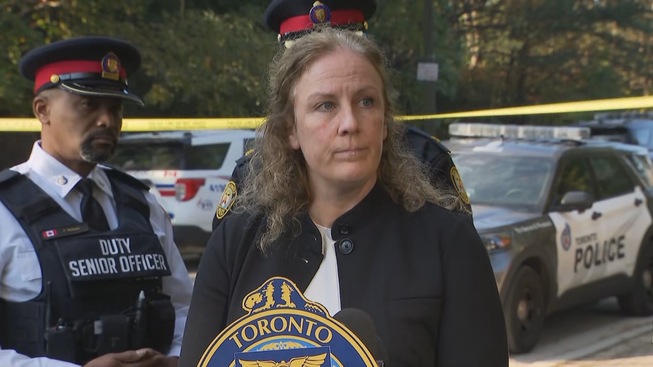 Woman at Toronto police podium
