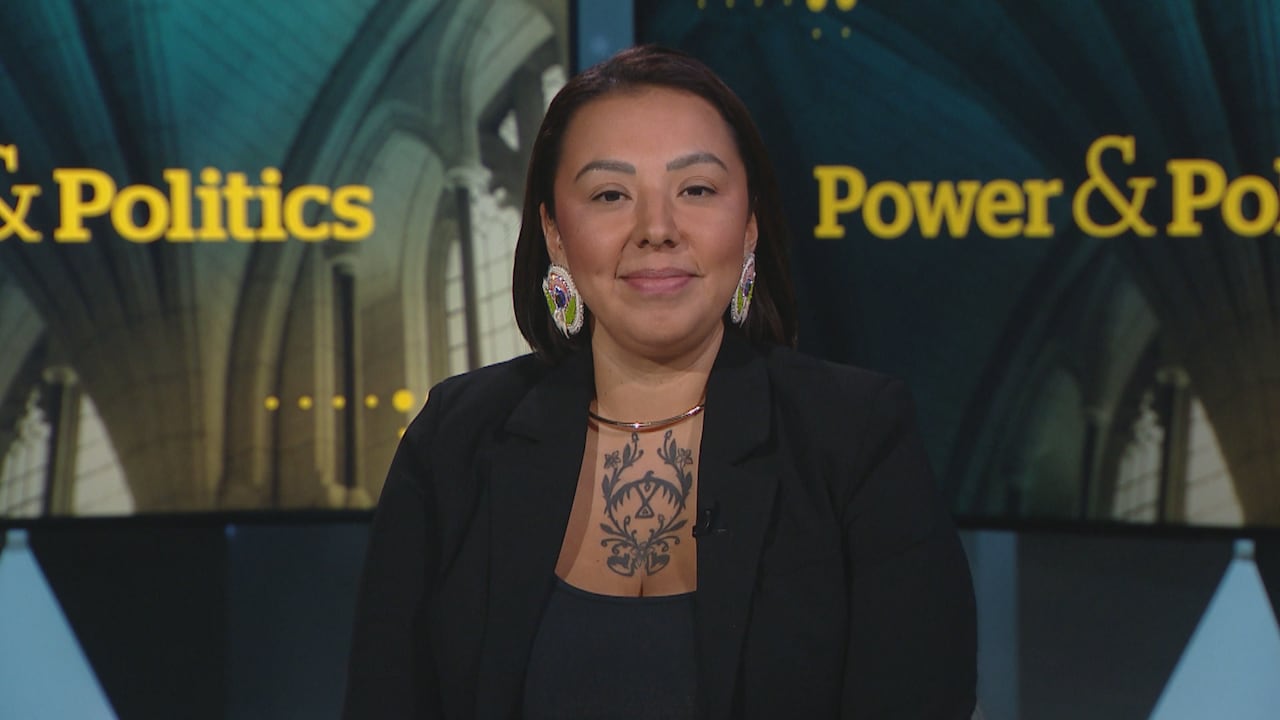 Woman smiling in a news studio