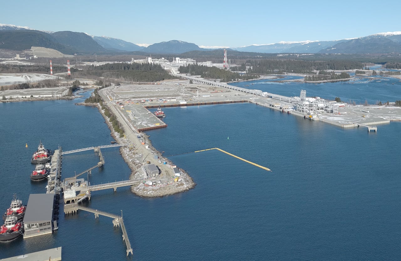 An industrial site on the side of the ocean.