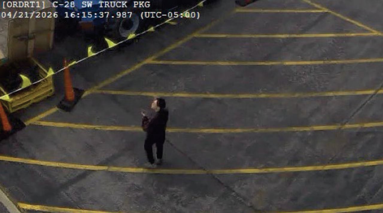 A man in dark clothing captured on CCTV.