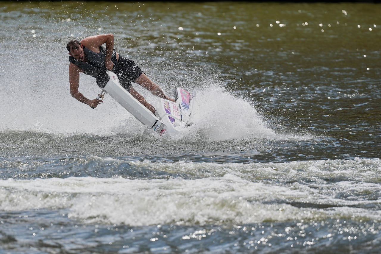 A man rides a stand-up jet ski on the Cumberland River during a heat advisory Saturday, July 26, 2025, in Nashville, Tenn.