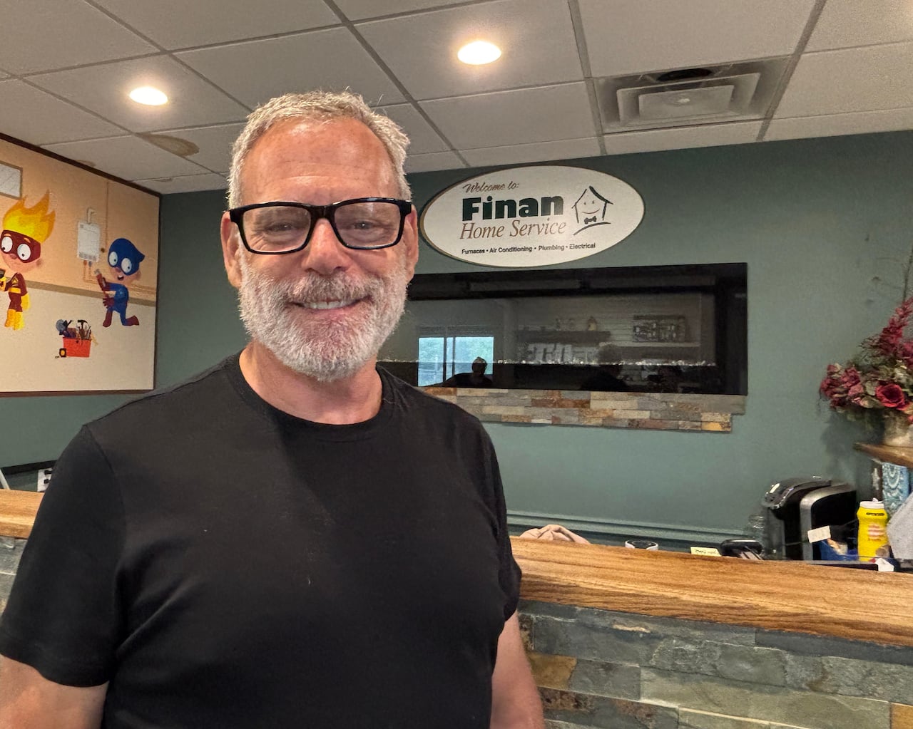 John Finan, owner of Finan Home Services, standing in the lobby of his company's office in London, Ont.