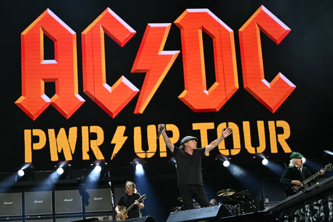 Rock band AC/DC is pictured on stage. 