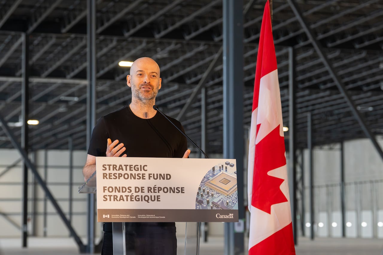 A person stands at a podium.